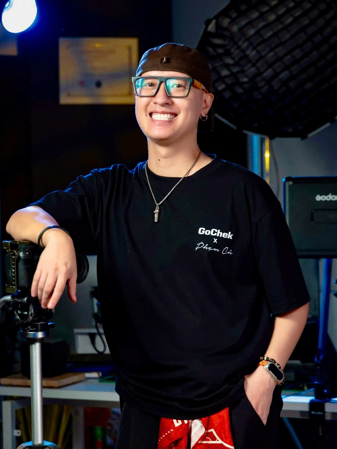 Professional studio portrait of Phạm Củ, a male influencer and branding expert, looking approachable and confident, sharp lighting, editorial business style.